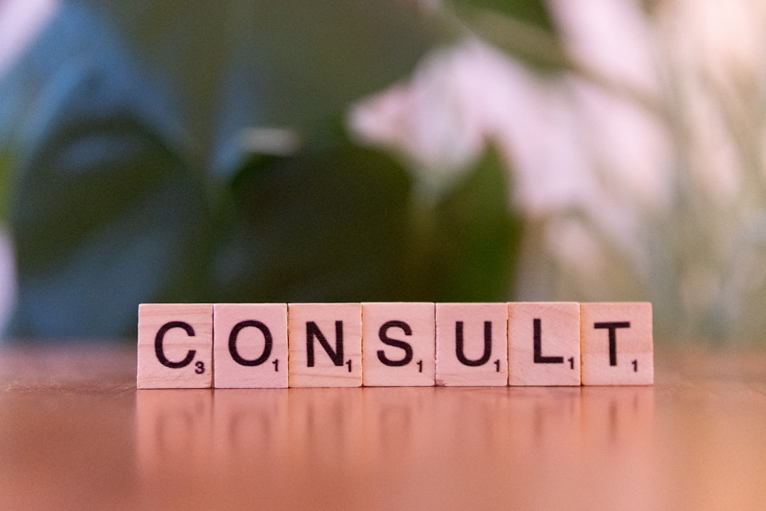 services-04 a-wooden-block-spelling-consulting-on-a-table-sewbkddizli
